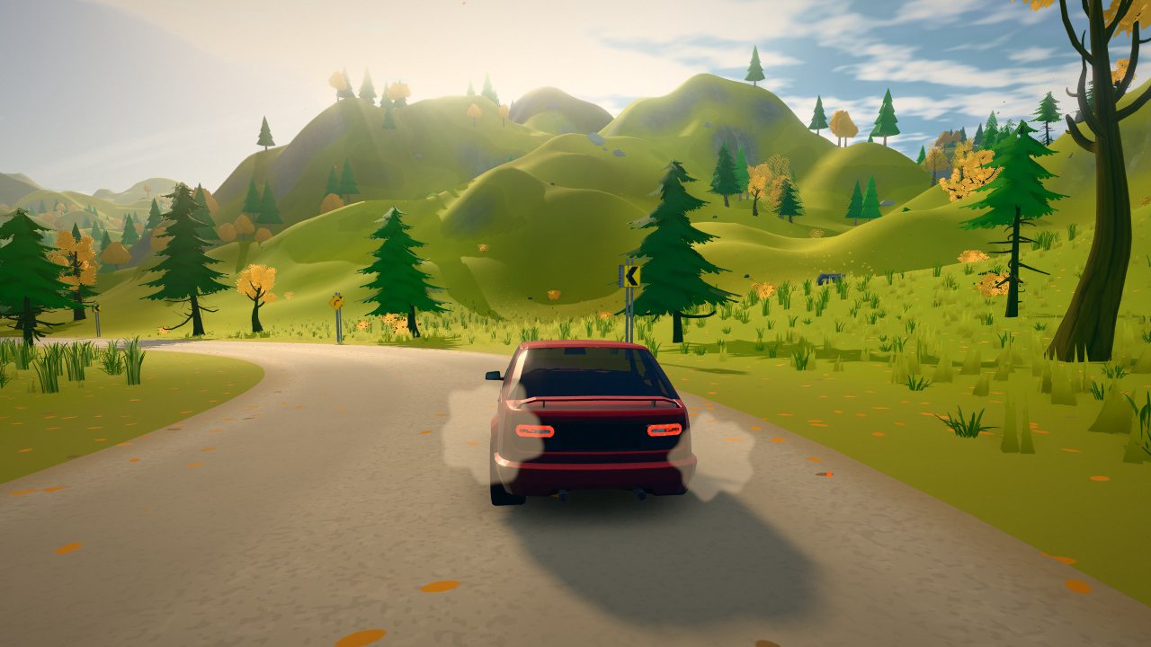 A gravel road through green hills and pine woods on a bright autumn afternoon.