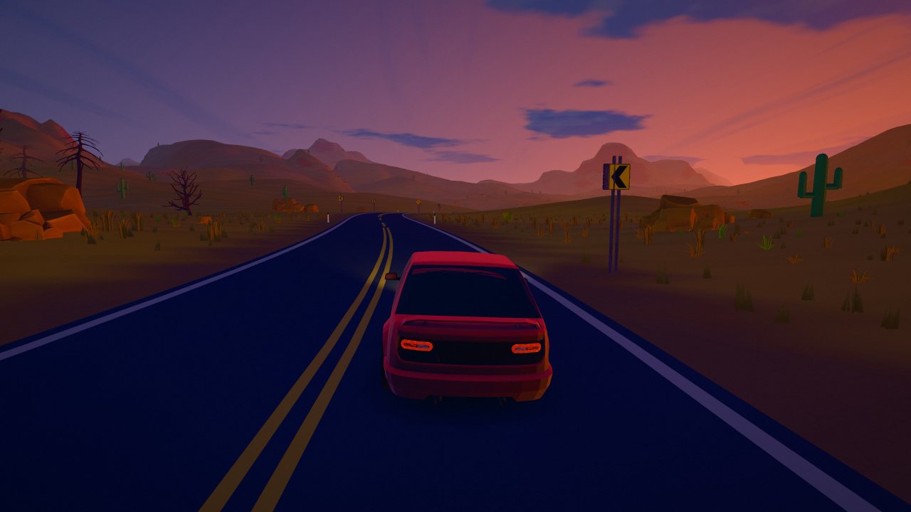 A straight road across the desert at dusk, red mesas and cacti on the horizon.